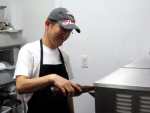 Scoops Owner Tai Kim Pouring Beer